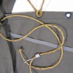 Armbruster's World War II tents use period rope, slides, OD tape, OD canvas, black brass grommets, and original thread.